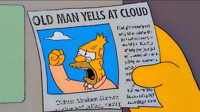 A cartoon image from The Simpsons showing a newspaper that Grandpa Simpson (Abe Simpson) is holding. The newspaper headline reads 'OLD MAN YELLS AT CLOUD' and features a picture of an angry elderly man (Grandpa Simpson himself) with his fist raised toward the sky, yelling at a cloud. The newspaper appears to be The Springfield Shopper, with some illegible text in the article below the headline.